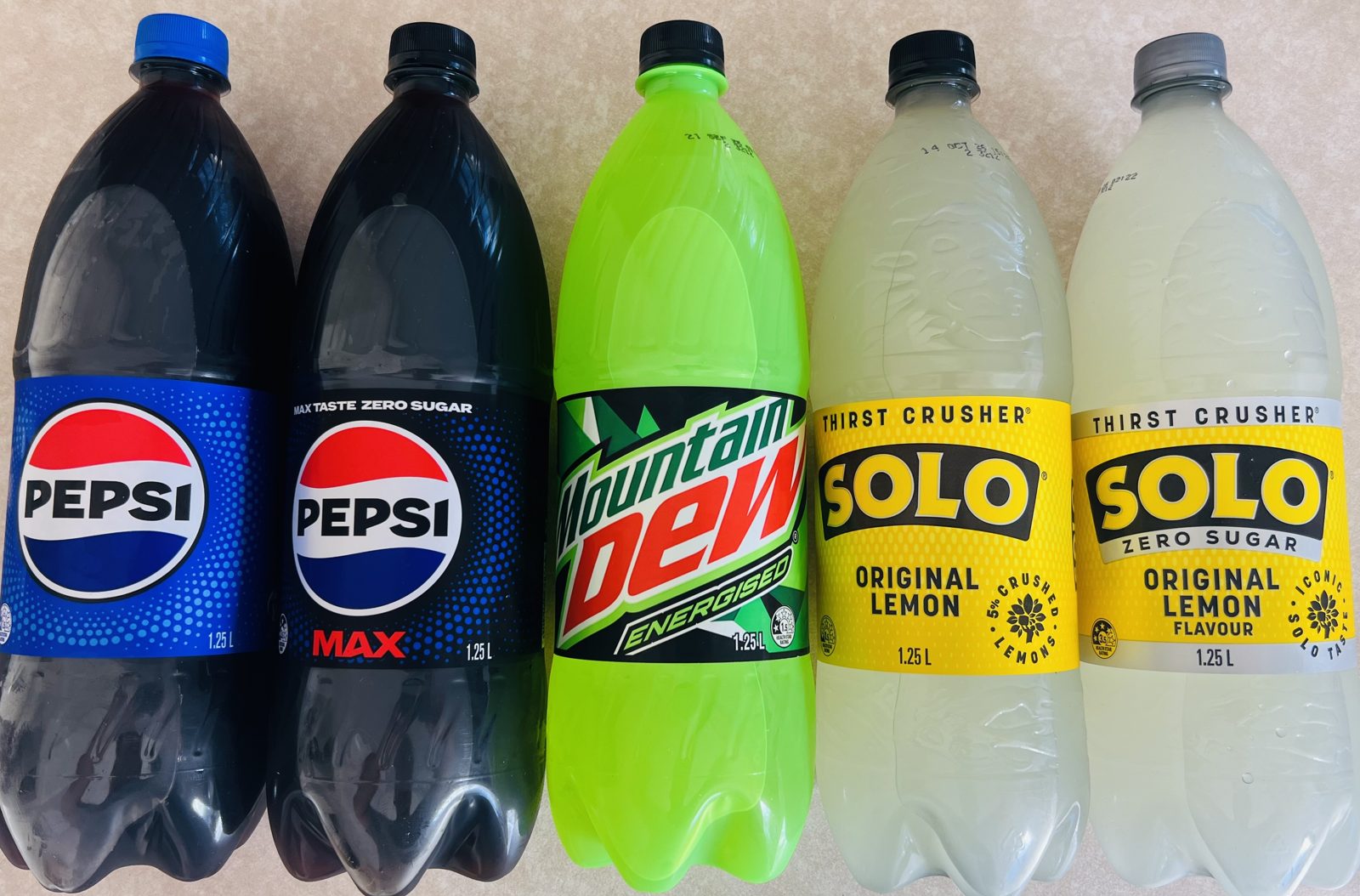 Ice-cold 1.25L drinks — Pepsi, Pepsi Max, Mountain Dew, Solo